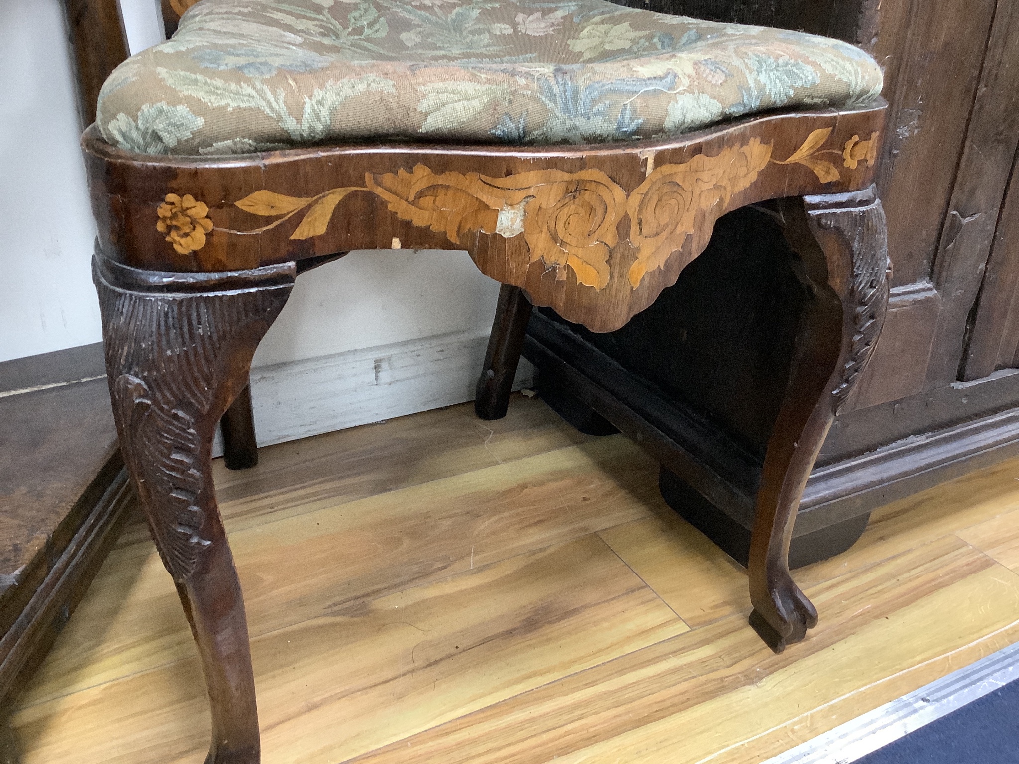 A pair of late 18th century Dutch floral marquetry walnut high back dining chairs